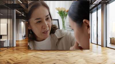 unhappy young adult asia people female lady feel sorry cry upset pensive share moment negative issue with old mum help consult sit sofa couch at home hand stroking hug cuddle love protect compassion. Wall mural