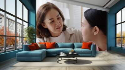 unhappy young adult asia people female lady feel sorry cry upset pensive share moment negative issue with old mum help consult sit sofa couch at home hand stroking hug cuddle love protect compassion. Wall mural