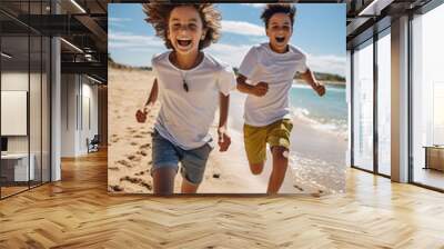 A couple of young and happy children run on a beach Wall mural