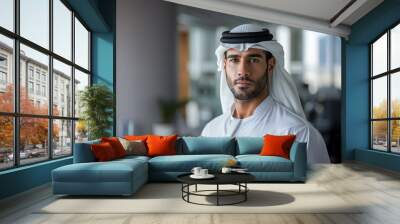 Portrait of Arab businessman dressed in traditional clothes, in an office. Muslim, Arab sheikh. Wall mural