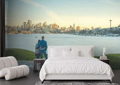 a couple hug and looking Seattle city landscape with sunset ,Seattle,Washington,USA. Wall mural