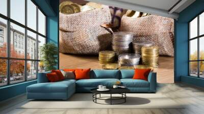 Coins on wooden background Wall mural