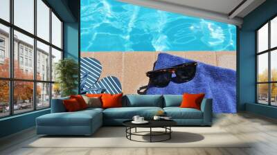 poolside sunglasses towel holiday vacation background scenic sunglasses shoes with copy space on swi Wall mural