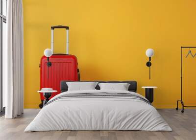 a red suitcase is sitting on a yellow background Wall mural