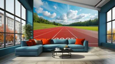 Red running track with 2025 painted on starting line leading to the horizon under sunny sky Wall mural