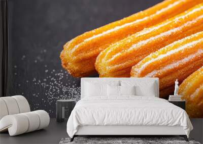 Delicious churros dusted with sugar, showcasing their crispy texture and golden color, perfect for dessert lovers. Enjoy this traditional treat! Wall mural