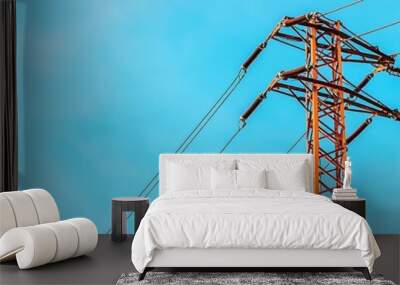 Electric power pole with tangled cables, blue sky backdrop, energy infrastructure and distribution, clean sky, electric technology concept Wall mural