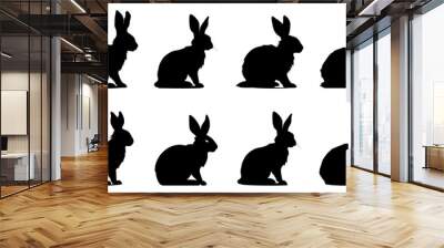 Rabbit black silhouettes. Set of Easter bunny icons isolated Wall mural