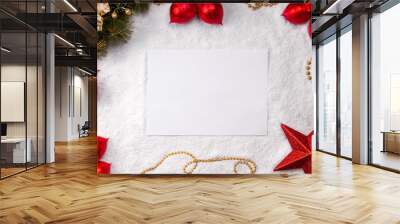 Sheet of white paper on snow christmas background top view mock up Wall mural