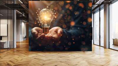 hand with illuminated light bulb, concept idea imagination development Wall mural