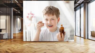 boy drinking cough syrup Wall mural