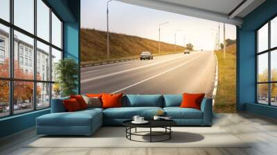 car driving on the asphalt road rural landscape Wall mural