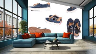 Used blue sneakers, old isolated on white background Wall mural