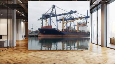 Container ship in asia port while load the job Wall mural