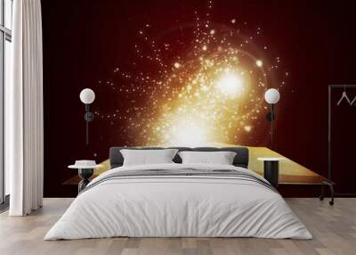 Old open book with magic light and falling stars Wall mural