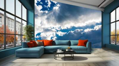 Beautiful white cumulonimbus clouds against the background of the bright blue sky Wall mural