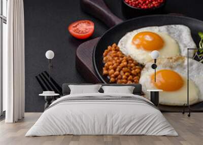 Delicious hearty breakfast consisting of two fried eggs, canned lentils and microgreens Wall mural