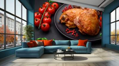 Delicious juicy chicken thighs baked with salt, spices and herbs in a ceramic plate Wall mural