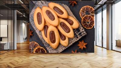 Delicious sweet crispy cookies with chocolate filling in the center Wall mural