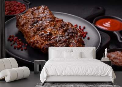 Fresh juicy delicious beef steak on a dark background Wall mural