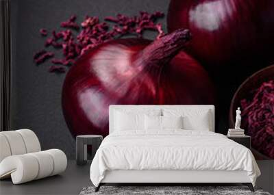 Fresh raw red onion on dark textured concrete background Wall mural