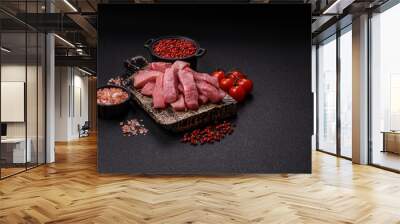 Juicy beef cut into slices with salt, spices and herbs Wall mural