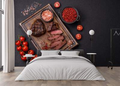 Juicy beef steak baked on the grill with salt, spices and herbs Wall mural