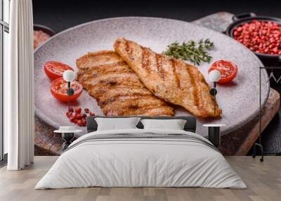 Juicy chicken fillet baked on the grill with salt, spices and herbs Wall mural