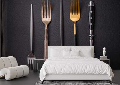 Kitchen fork made of steel on a dark textured background Wall mural