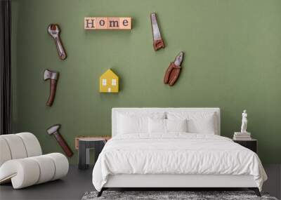 Repair or home improvement tools and a house model on a plain background Wall mural