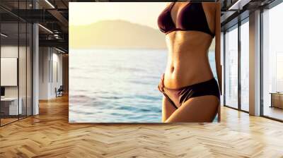 Attractive female fit body in bikini Wall mural