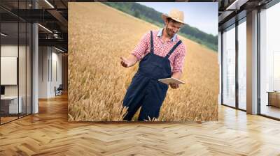 Friendly farmer and tablet Wall mural