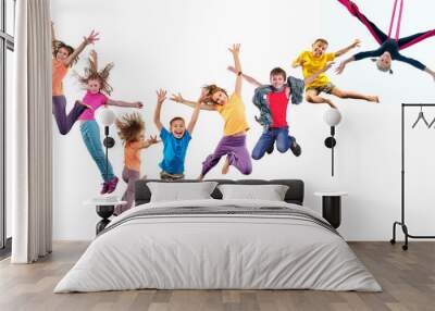 group of happy cheerful sportive children jumping and dancing Wall mural