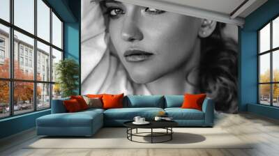 Young blonde woman in a casual white shirt and jeans in a loft interior, close up fashion portrait Wall mural