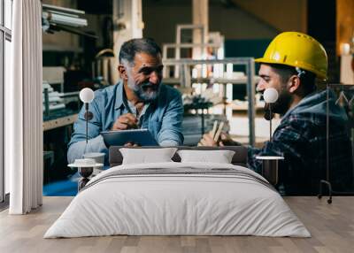 blue collar workers talking on lunch break at warehouse Wall mural