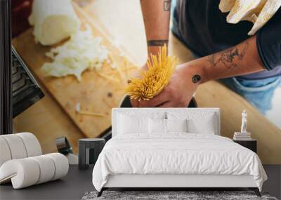 close up of man preparing pasta at home Wall mural