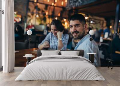 man and woman couple eating in restaurant Wall mural