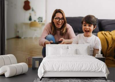 mother and son playing video games at home Wall mural