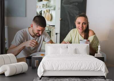 romantic couple having breakfast at home Wall mural