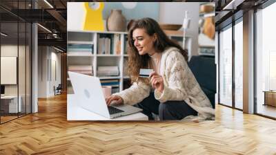 woman shopping on line from her home Wall mural