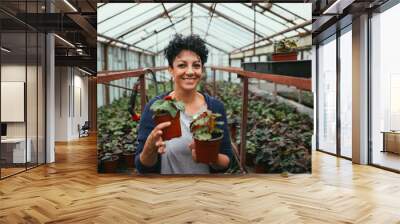 women working in greenhouse flower nursery Wall mural