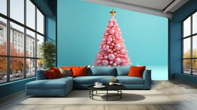 Pink colour New Year tree with glass balls on light teal background. Merry Christmas happy holidays concept Wall mural