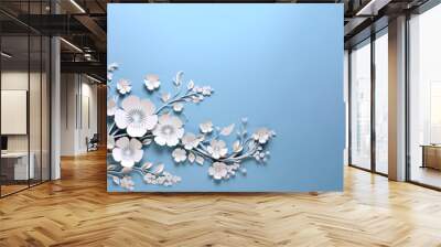 Winter paper cut white flowers on blue empty background with copy space surface. Origami art craft wedding design decor Wall mural