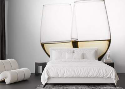 Two glasses with white wine and grapes on white background Wall mural