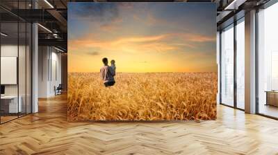 man in wheat field with boy Wall mural