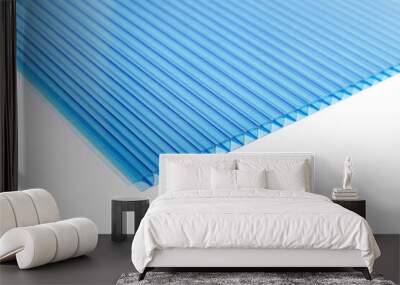 Polycarbonate plastic sheets panels images. PC hollow sheet for translucent roofing close up. Single light blue color on white background Wall mural