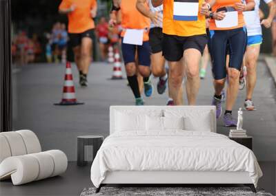 athletes run the marathon on the city road without logos Wall mural