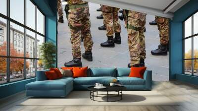 combat boots of army soldiers in camouflage uniforms standing in formation Wall mural