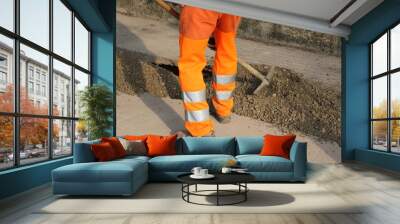 man at work with orange pants in the site Wall mural