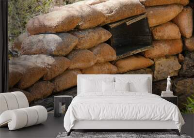 many Sandbags of a trench dug in the ground to defend army soldiers from enemy raids Wall mural